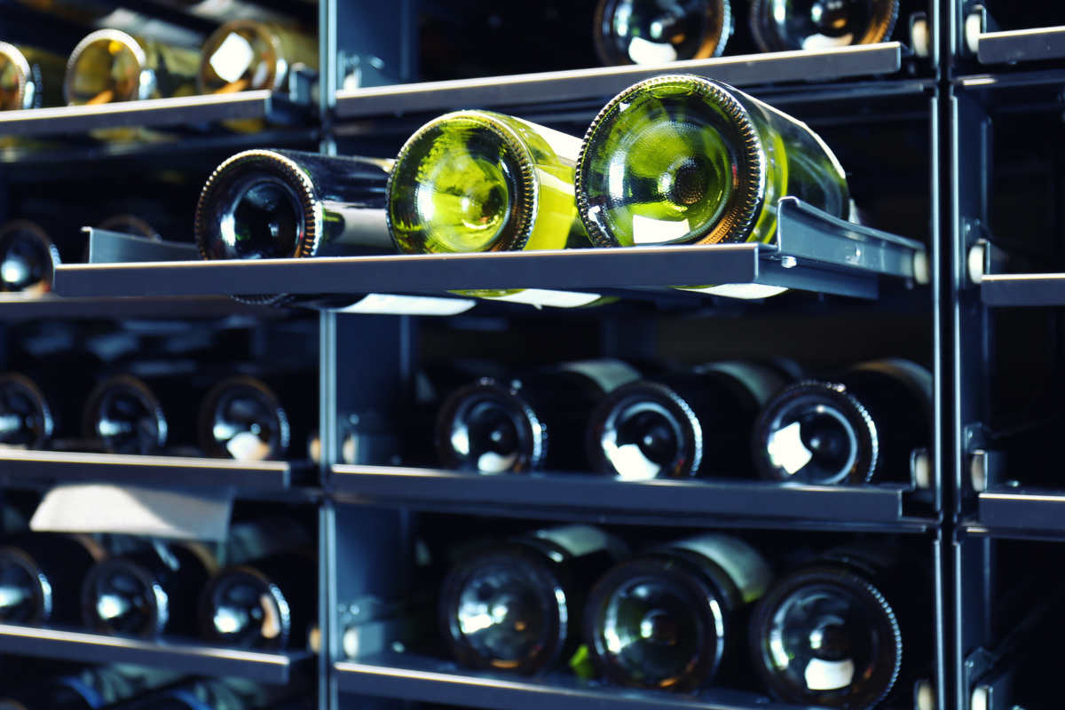 White wine in a wine cooler storage rack.